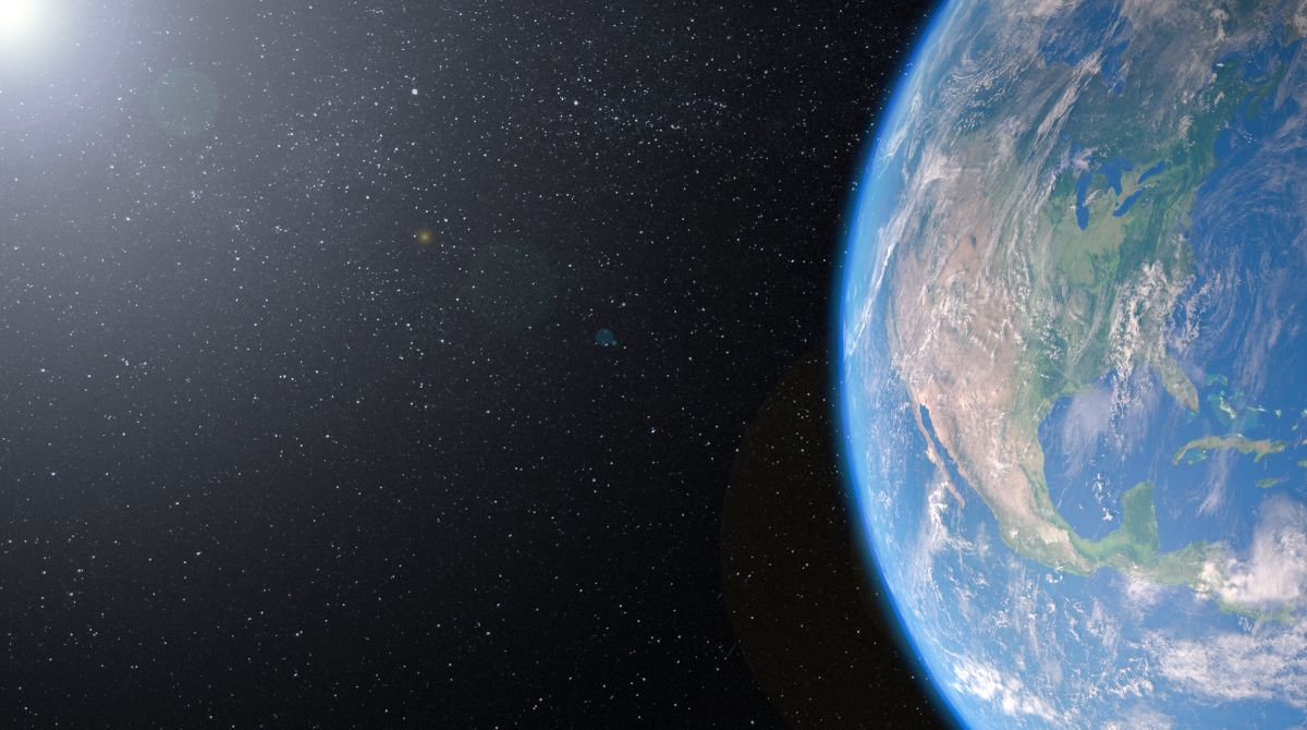 Render with Earth on the right third showing North America and the left two thirds is the sun and deep space.